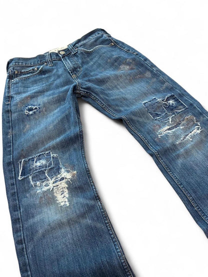 Sashiko repaired patchwork jeans w/ rust splatter